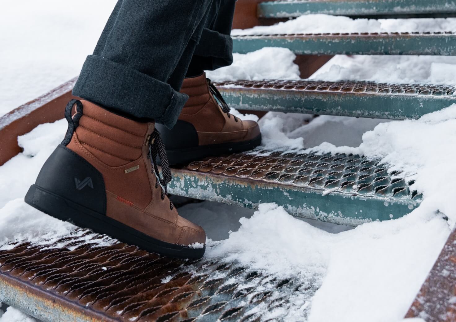 Shop Forsake Men's featuring the Mason High in toffee going up snow covered steps.