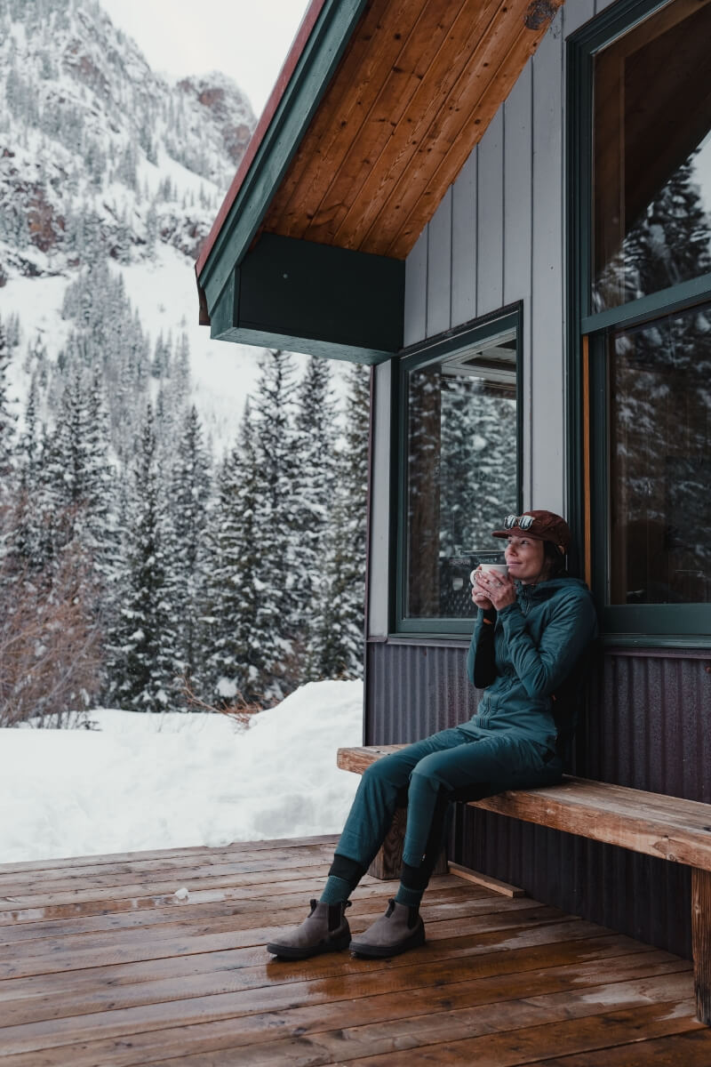 The featured image shows a person wearing Forsake shoes sitting on a bench outside while holding a mug.