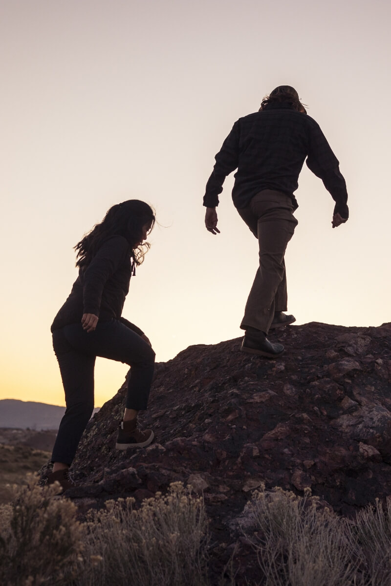 The featured image shows a person wearing Forsake shoes while walking a dog on a hiking path.